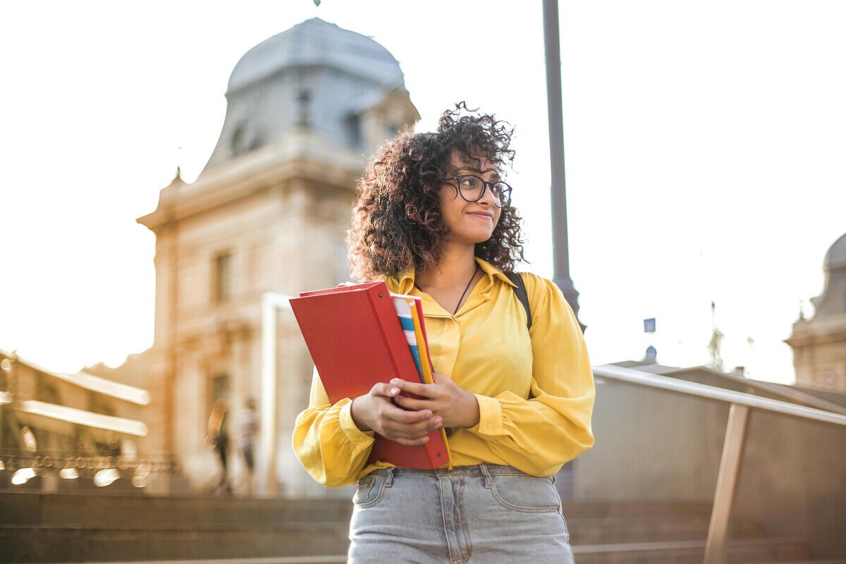 Female college student feeling confident for her ACT test after completing her ACT one-on-one online tutoring boot camp.